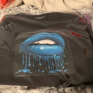 A black t shirt with blue sky lips